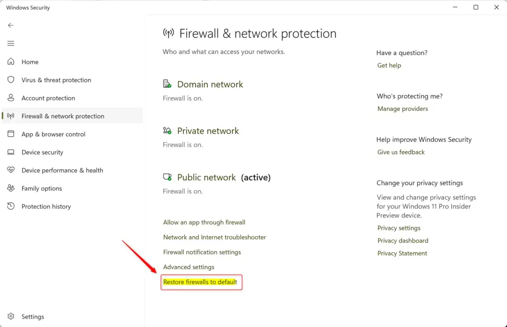 Windows 11 Firewall settings showing option to restore to default.