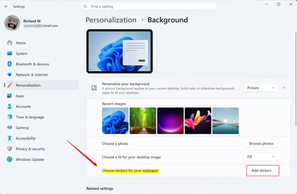 User selecting and choosing stickers for Windows 11 desktop.