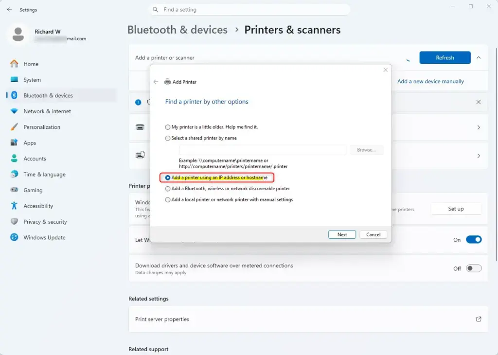 Windows 11 Add printer by IP address or hostname option.
