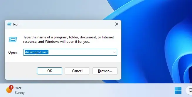 Opening Disk Management tool in Windows 11 via Run command.