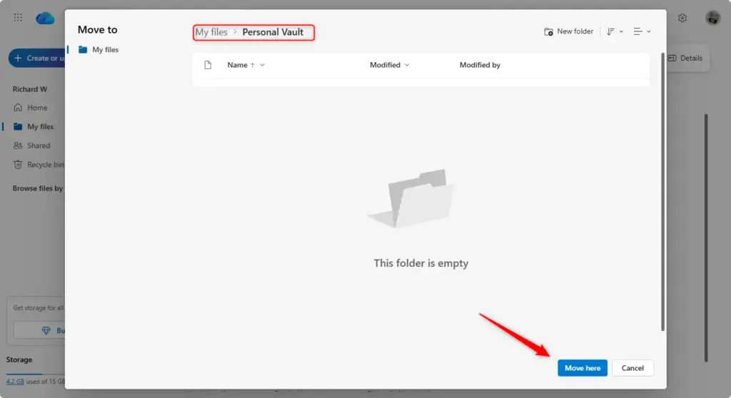 Dragging and dropping files into the OneDrive Personal Vault folder.