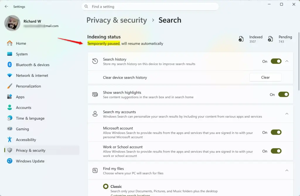 Windows Search indexing paused notification on a computer screen.